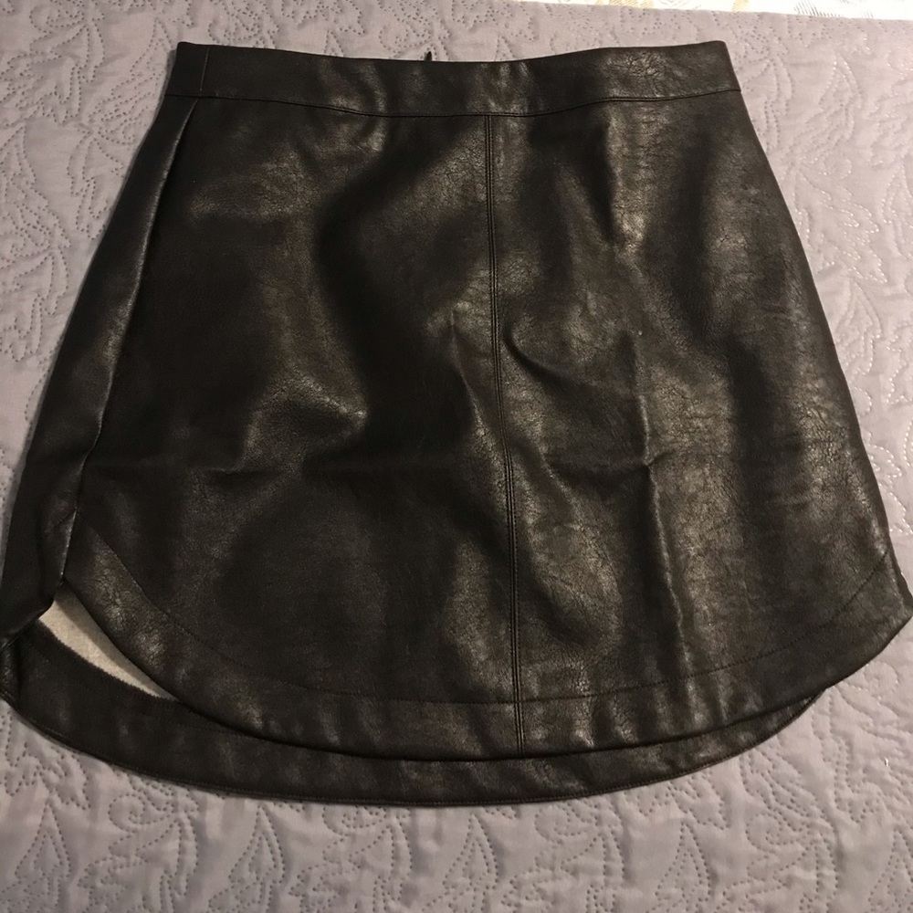 Black faux leather rounded hem skirt. NWT